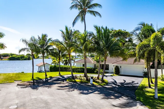 a view of swimming pool with a table and chairs