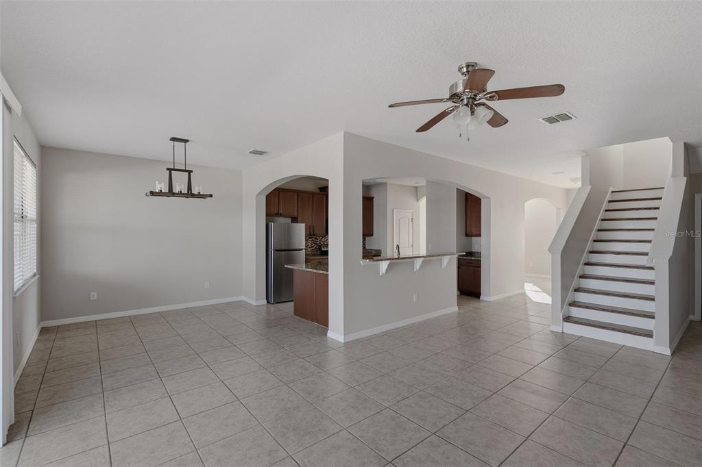 2318 Sebago Drive Lakeland, FL 33805 - Photo 14 of 54 a view of a kitchen with wooden cabinet and a hallway