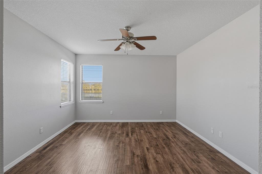 2318 Sebago Drive Lakeland, FL 33805 - Photo 18 of 54 wooden floor in an empty room with a window