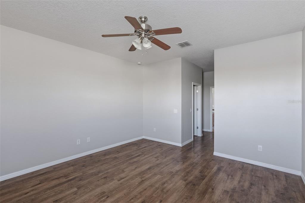 2318 Sebago Drive Lakeland, FL 33805 - Photo 19 of 54 wooden floor in an empty room