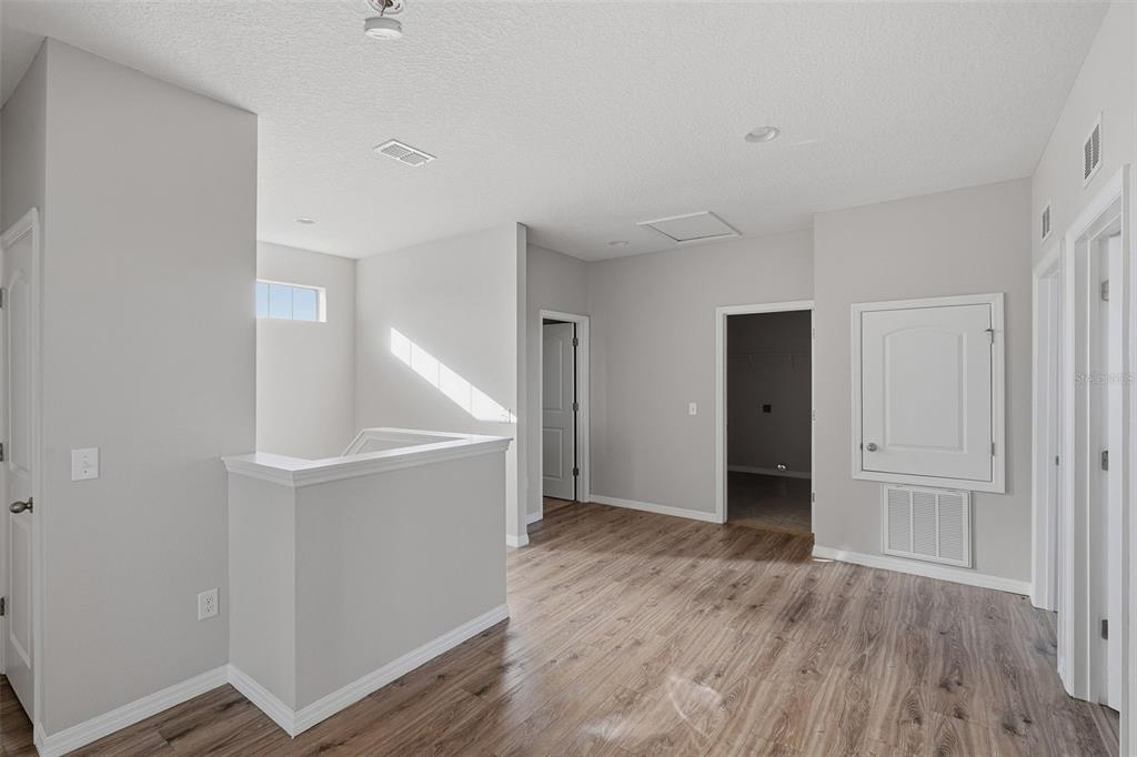 2318 Sebago Drive Lakeland, FL 33805 - Photo 24 of 54 wooden floor in an empty room with a window