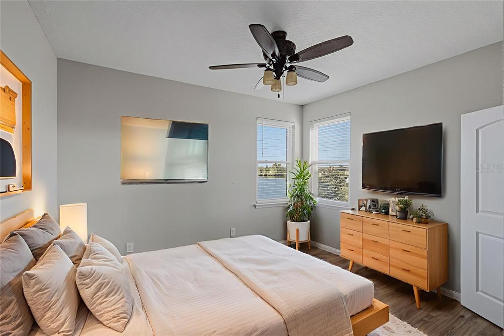 2318 Sebago Drive Lakeland, FL 33805 - Photo 30 of 54 a bedroom with a bed and a flat screen tv