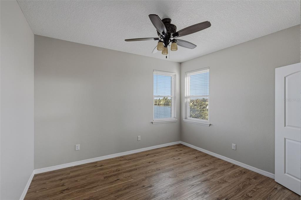 2318 Sebago Drive Lakeland, FL 33805 - Photo 31 of 54 a view of a big room with wooden floor and windows
