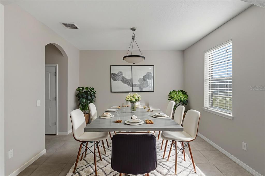 2318 Sebago Drive Lakeland, FL 33805 - Photo 5 of 54 a view of a dining room with furniture window and wooden floor