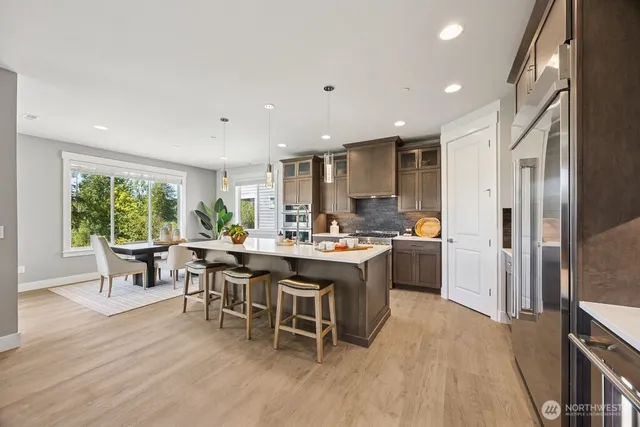 a kitchen with a table and chairs