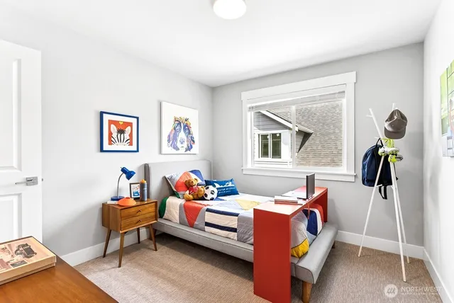 a bedroom with furniture and a window