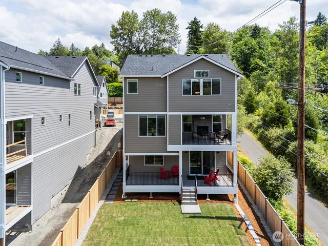 a view of house with a yard