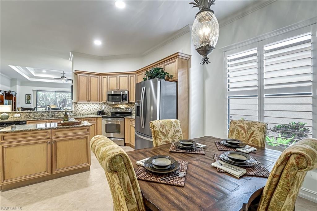 7523 Moorgate Point Way Naples, FL 34113 - Photo 16 of 32 Dining area can easily accomodate 6 or more people!