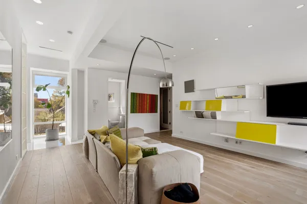 a living room with furniture and flat screen tv