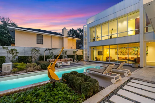 a view of a swimming pool with a patio