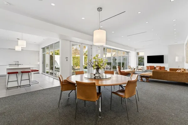 a view of a dining room with furniture and a livingroom