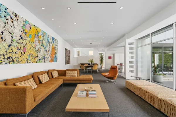 a living room with furniture and a rug