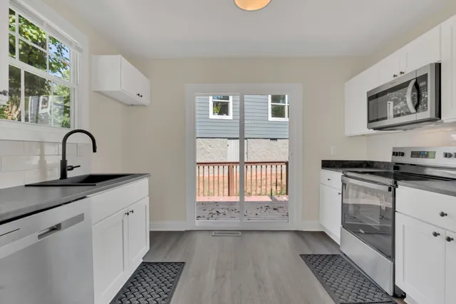 a kitchen with a sink and cabinets