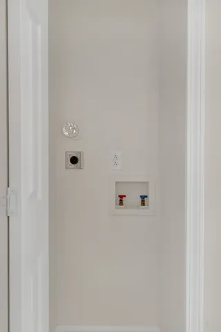 a white wall with cabinets
