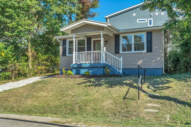 a front view of a house with a yard