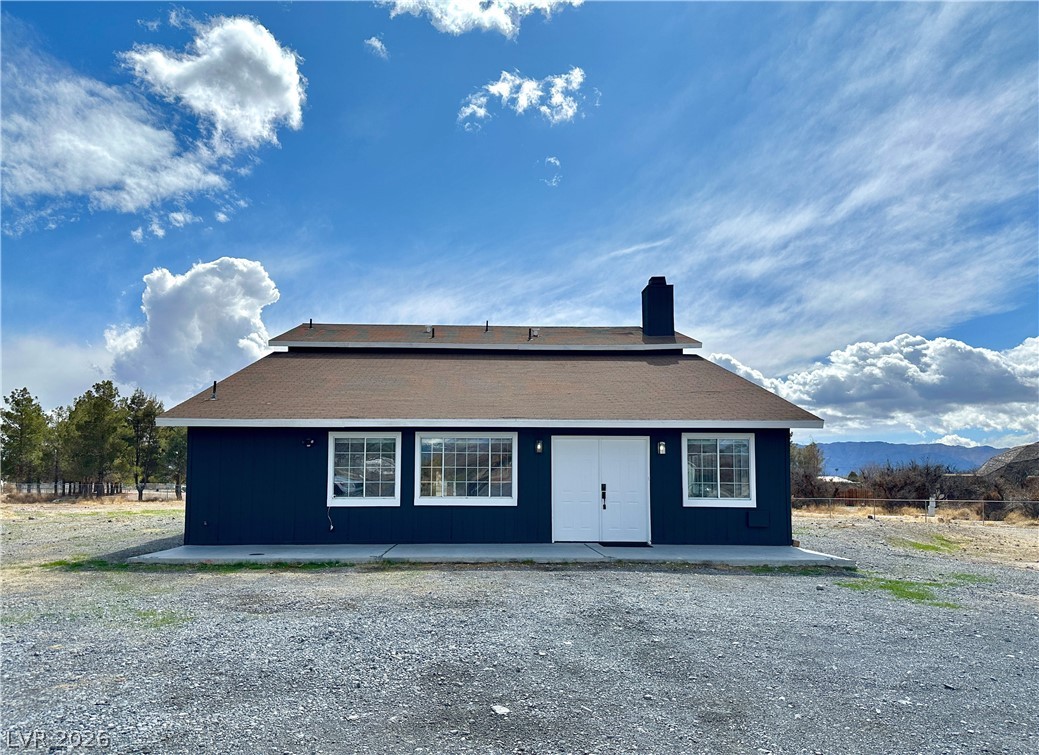 1891 Brian Road Pahrump, NV 89048 - Photo 47 of 50 View of front of home with a patio area and a chimney