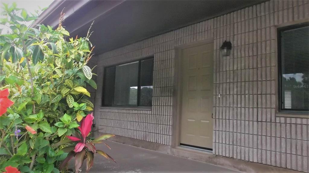 9000 Griggs Road, Unit C Englewood, FL 34224 - Photo 1 of 10 a backyard of a house