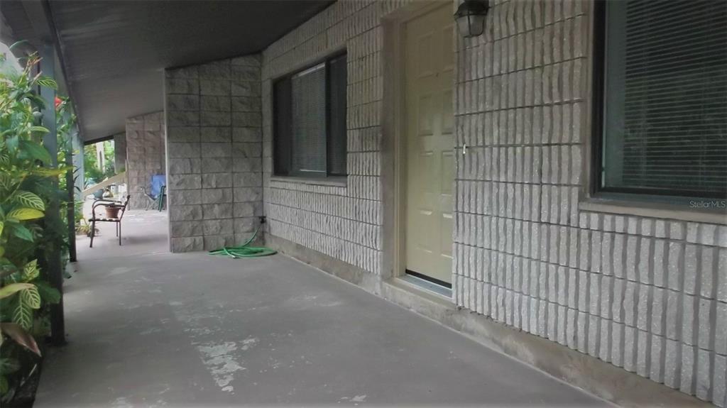 9000 Griggs Road, Unit C Englewood, FL 34224 - Photo 2 of 10 a view of a house with a street