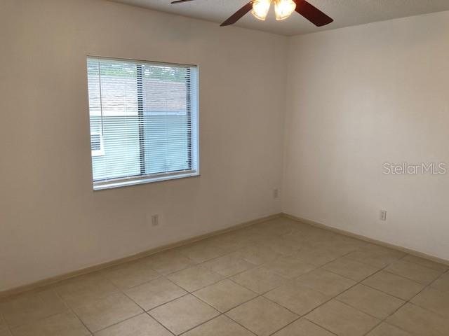 9000 Griggs Road, Unit C Englewood, FL 34224 - Photo 9 of 10 an empty room with a window