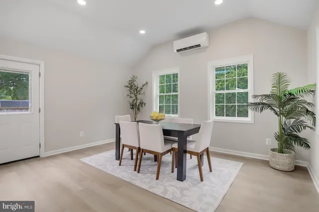 a dining room with furniture and window
