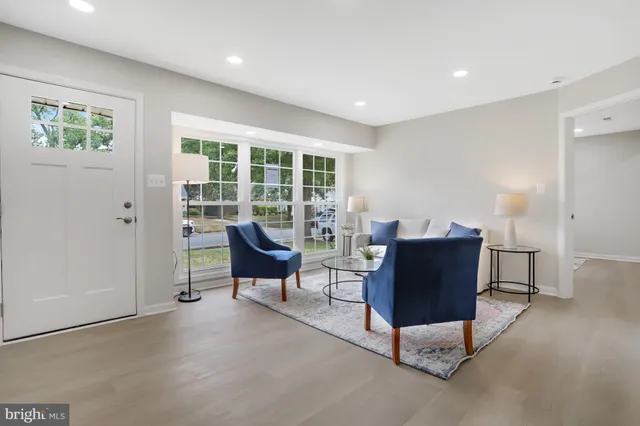 a living room with furniture and a rug