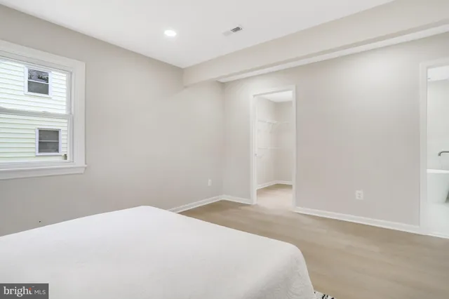 a bathroom with a bathtub and window