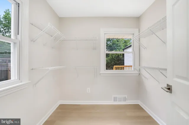 a bathroom with a bathtub a sink and a mirror