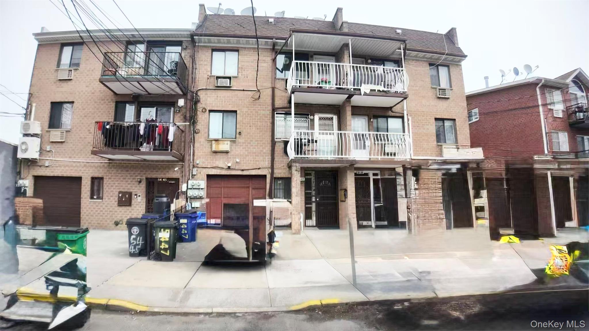54-47 83rd Street Queens, NY 11373 - Photo 2 of 2 a view of a building with sitting area