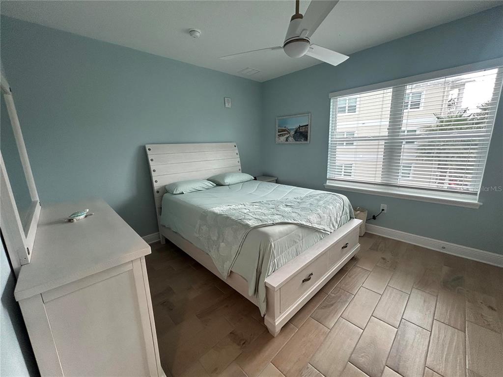 3426 79th Street Circle West, Unit 203 Bradenton, FL 34209 - Photo 19 of 30 a bedroom with a bed and a window