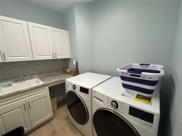 a utility room with dryer and washer