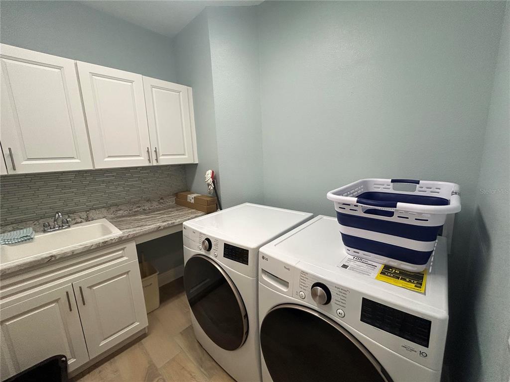 3426 79th Street Circle West, Unit 203 Bradenton, FL 34209 - Photo 21 of 30 a utility room with dryer and washer