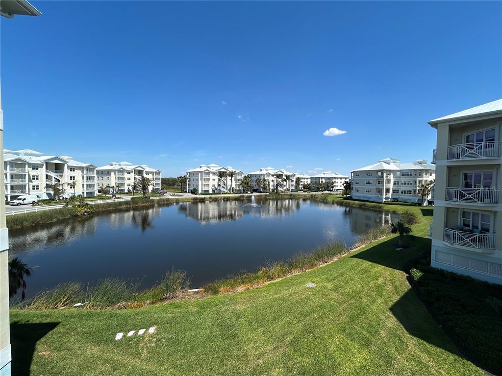3426 79th Street Circle West, Unit 203 Bradenton, FL 34209 - Photo 29 of 30 a view of a lake with boats and trees in the background