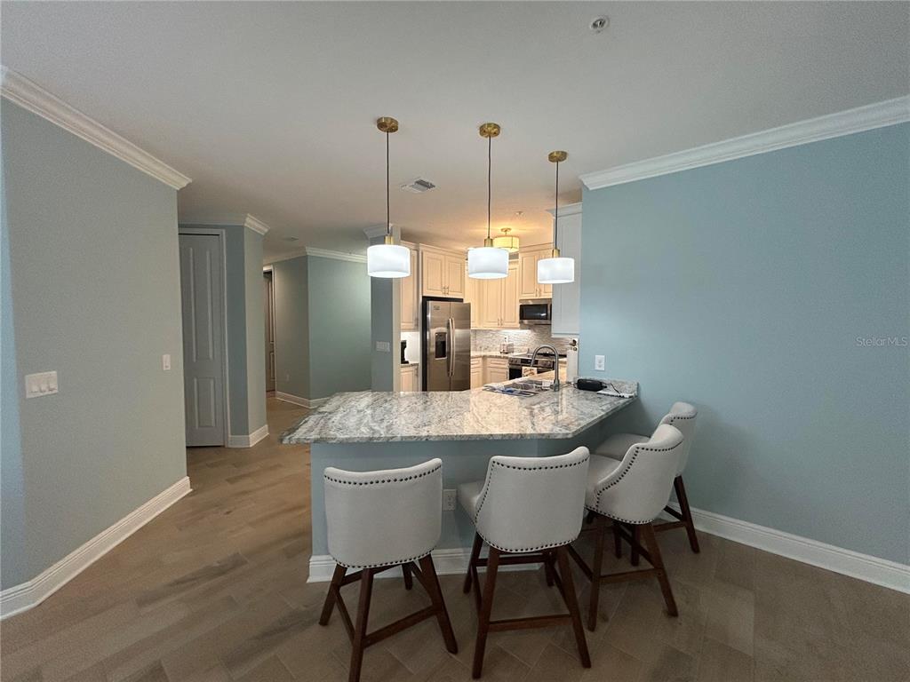 3426 79th Street Circle West, Unit 203 Bradenton, FL 34209 - Photo 6 of 30 a dining room with furniture and window