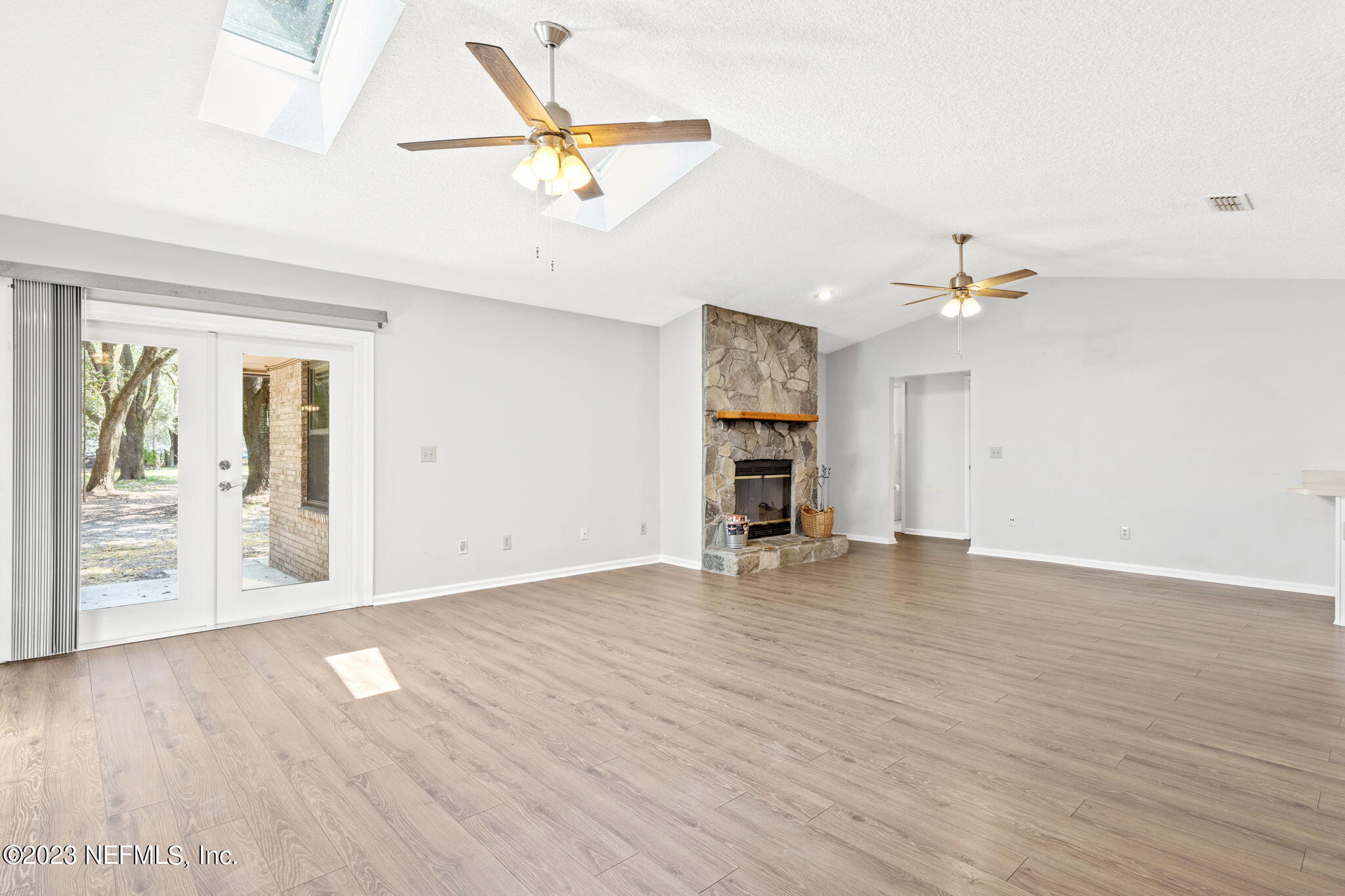 3233 Fritz Road Jacksonville, FL 32226 - Photo 11 of 43 wooden floor in an empty room with a window