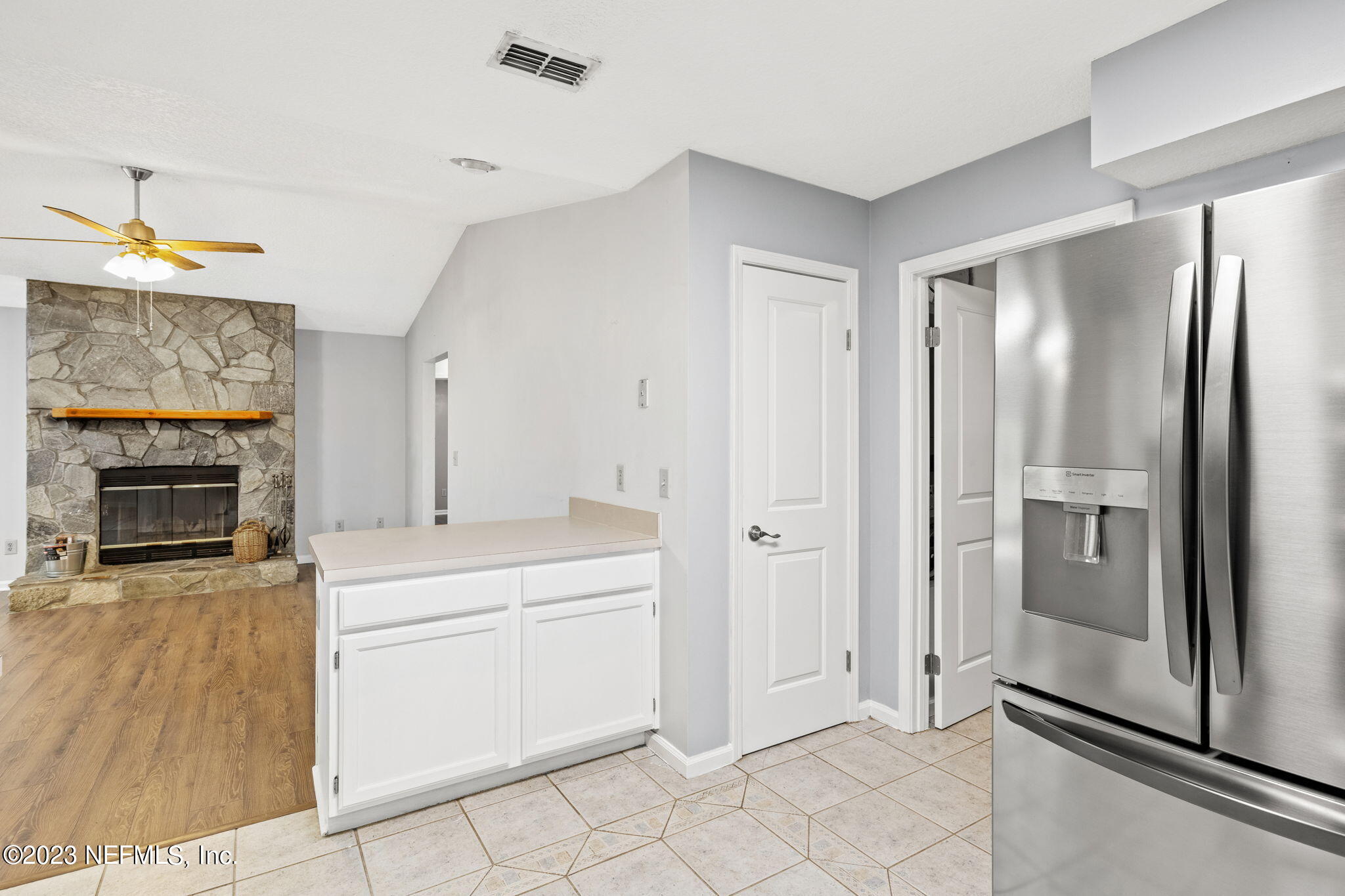 3233 Fritz Road Jacksonville, FL 32226 - Photo 20 of 43 a room with chandelier fan and fire place