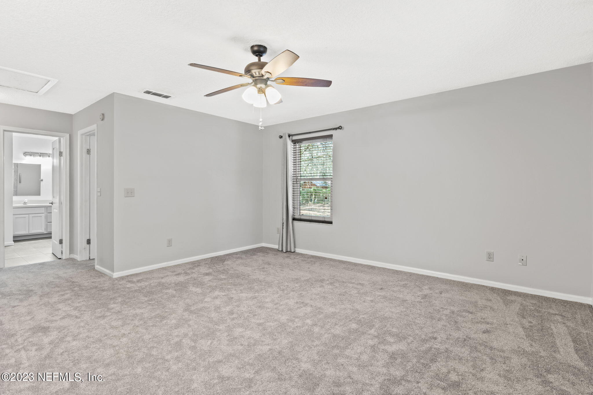 3233 Fritz Road Jacksonville, FL 32226 - Photo 24 of 43 an empty room with windows and fan