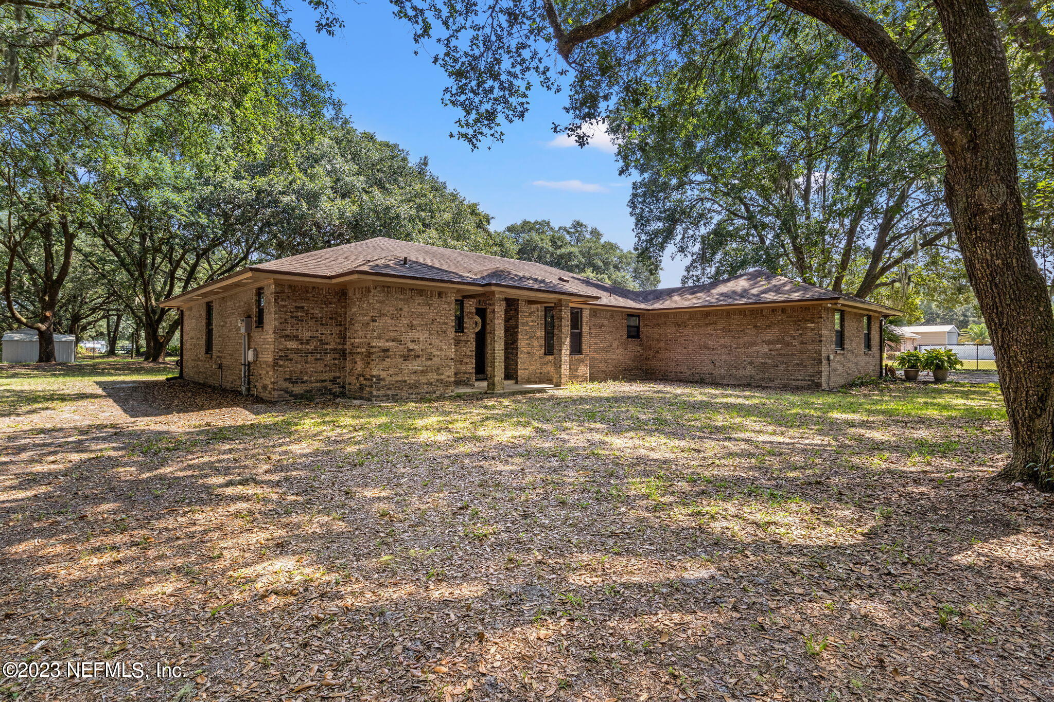 3233 Fritz Road Jacksonville, FL 32226 - Photo 3 of 43 a front view of a house with a garden