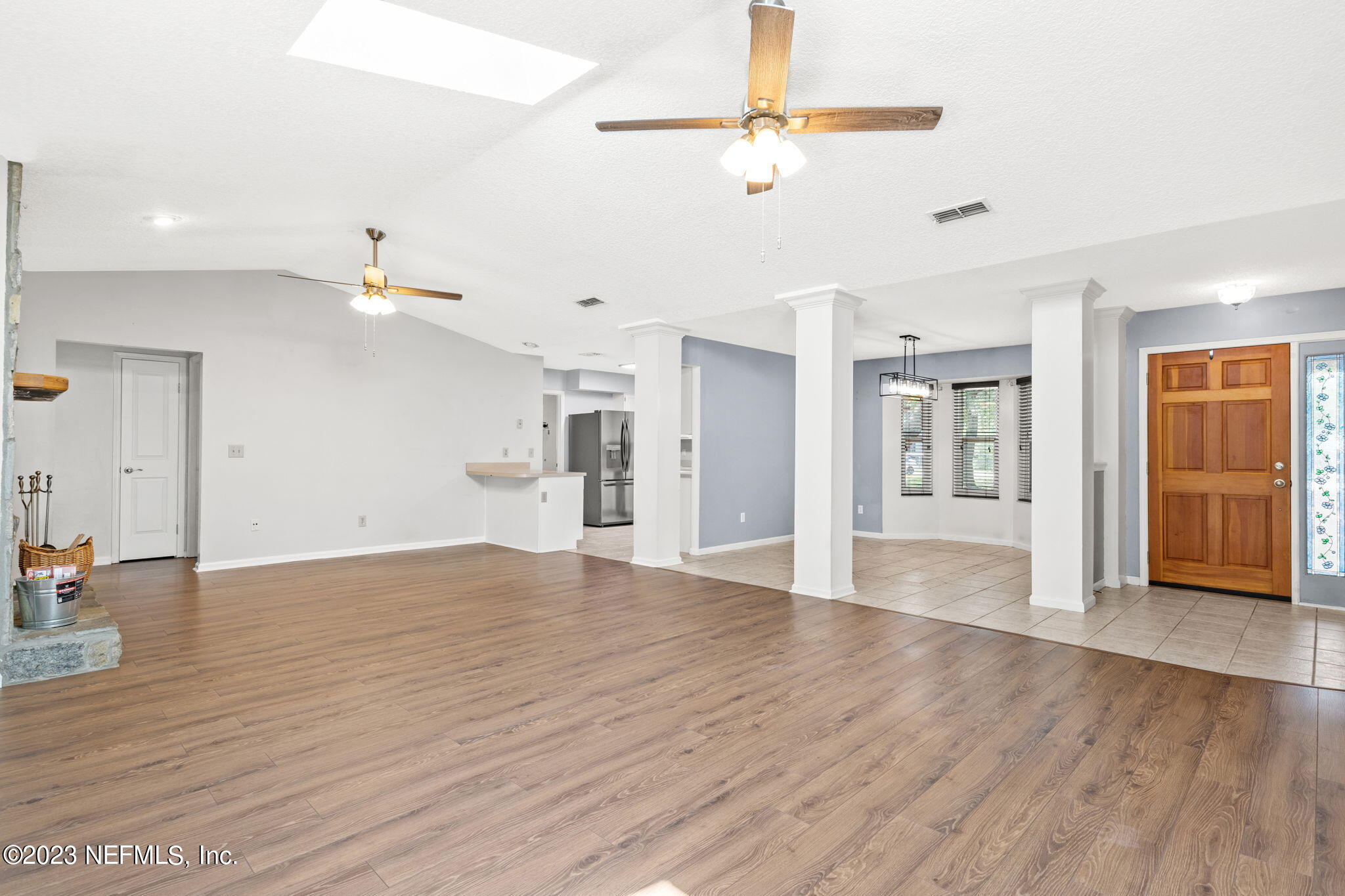3233 Fritz Road Jacksonville, FL 32226 - Photo 6 of 43 a view of an empty room with window and wooden floor
