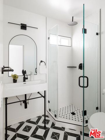 a bathroom with a sink and mirror