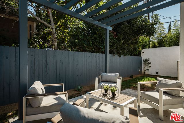 a view of yard with patio