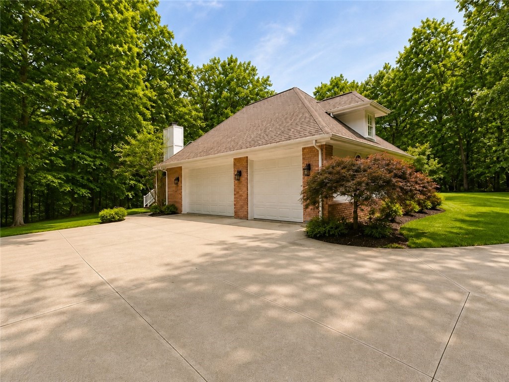 59 Kickapoo Valley Drive Charleston, IL 61920 - Photo 42 of 46 a front view of a house with a yard and garage