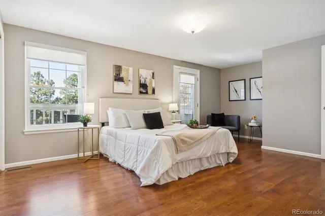 a bedroom with a large bed and a window