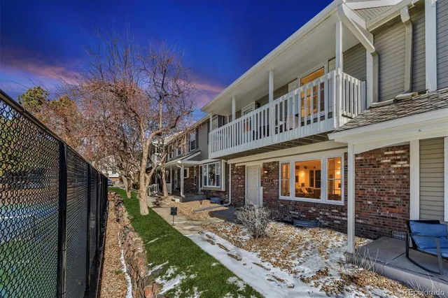 a view of a building with a yard