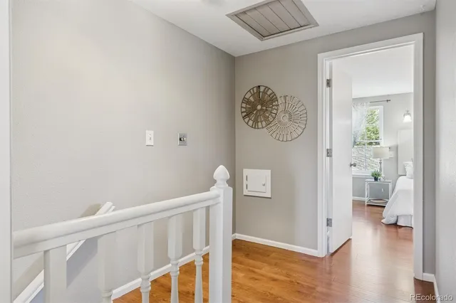 a view of an entryway with wooden floor