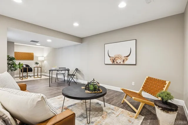 a living room with furniture and a table