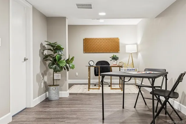 a workspace with furniture and wooden floor
