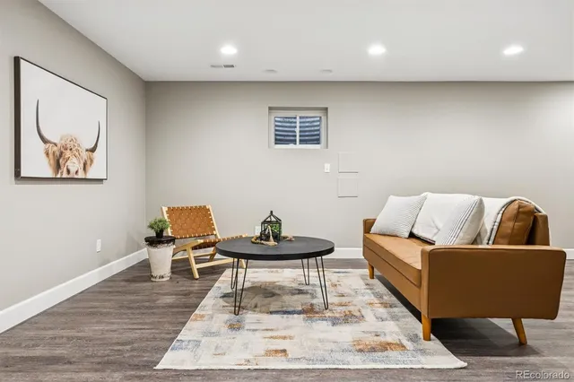 a living room with furniture and a rug