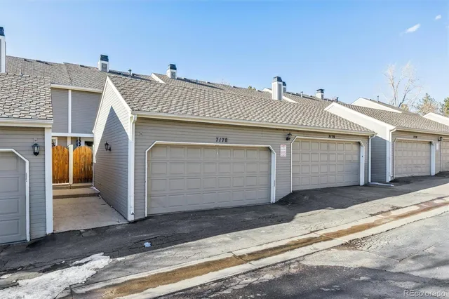 a front view of a house with a garage