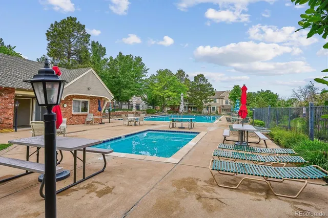 a view of a balcony with two chairs and a table