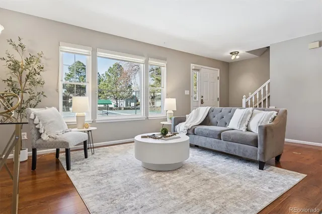 a living room with furniture and a large window